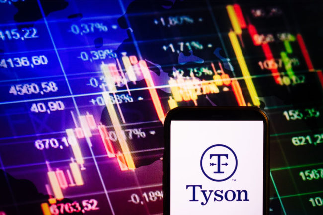 Tyson logo against a background of stock exchange charts