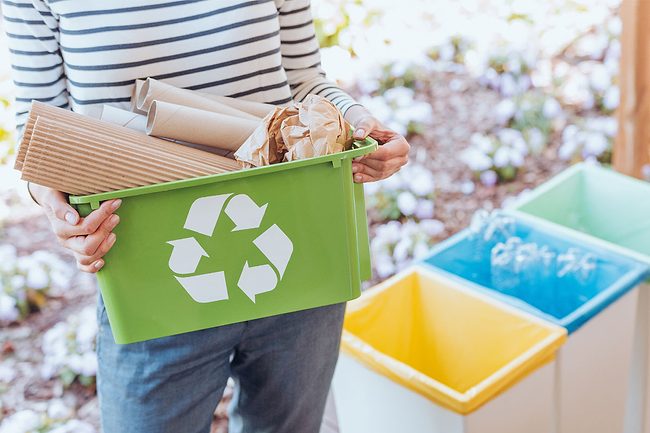 A woman recycling