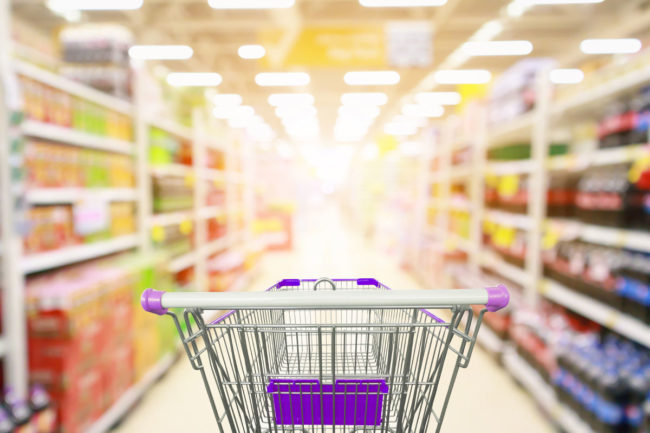 Shopping cart in a supermarket aisle