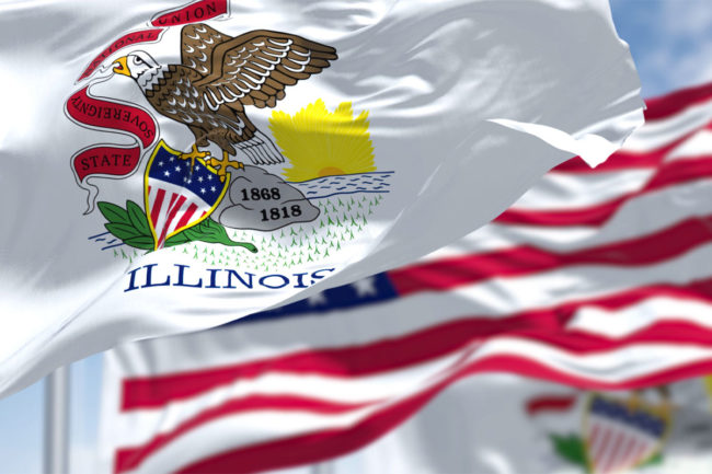 Illinios state flag waving in front of American flag