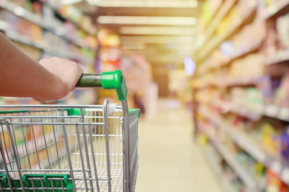 Grocery store cart in aisle