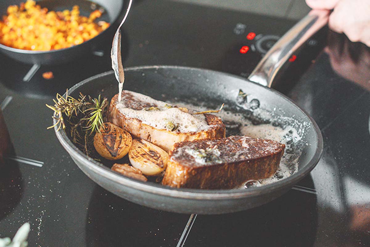 Steak in frying pan