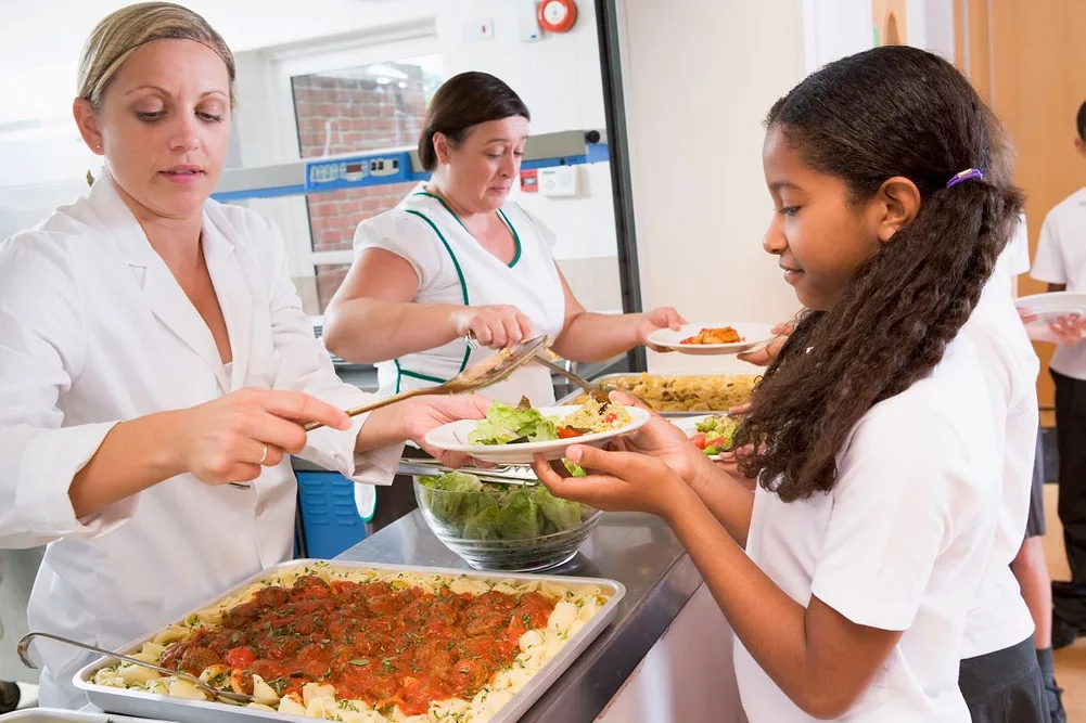 schoolgirl getting food