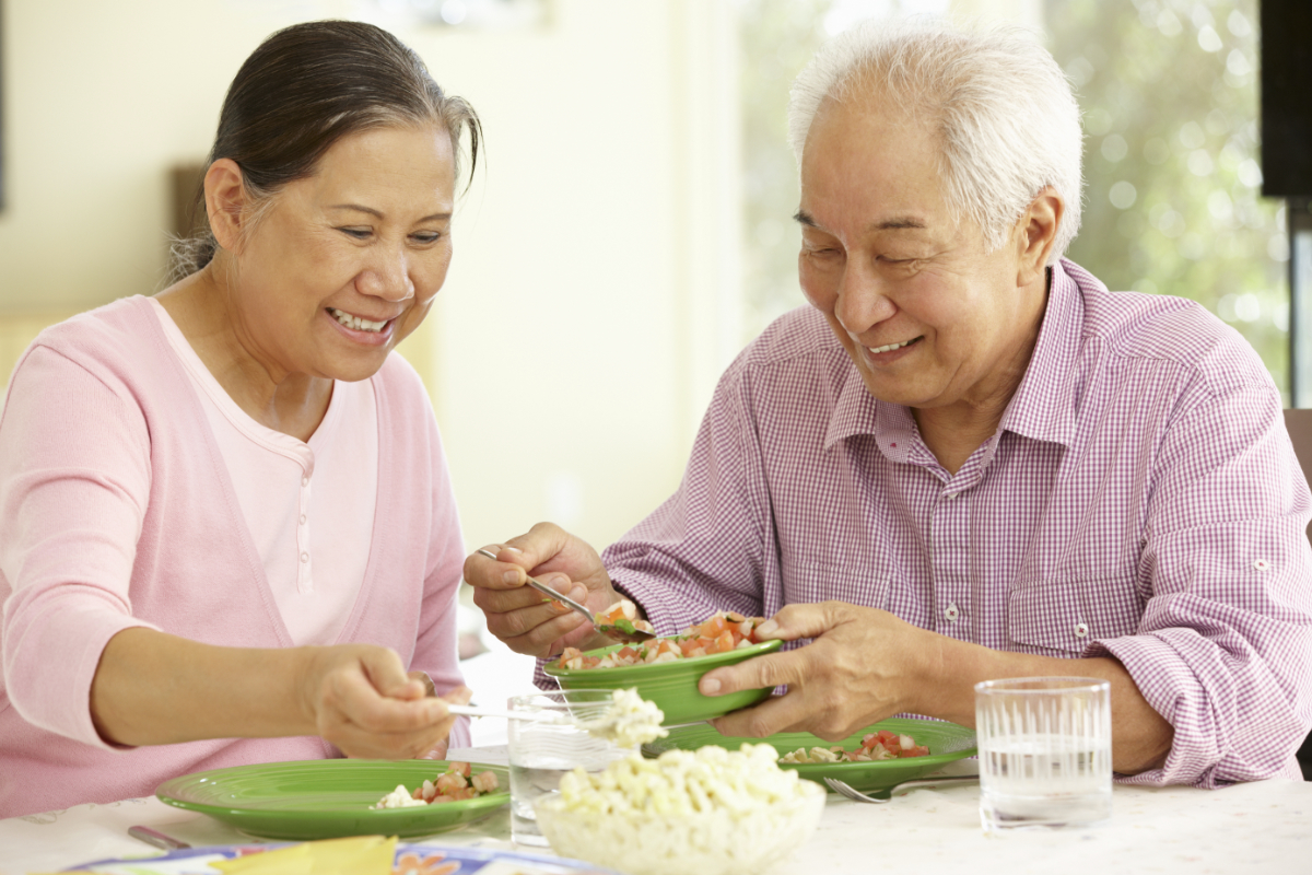 Senior Asian couple eating